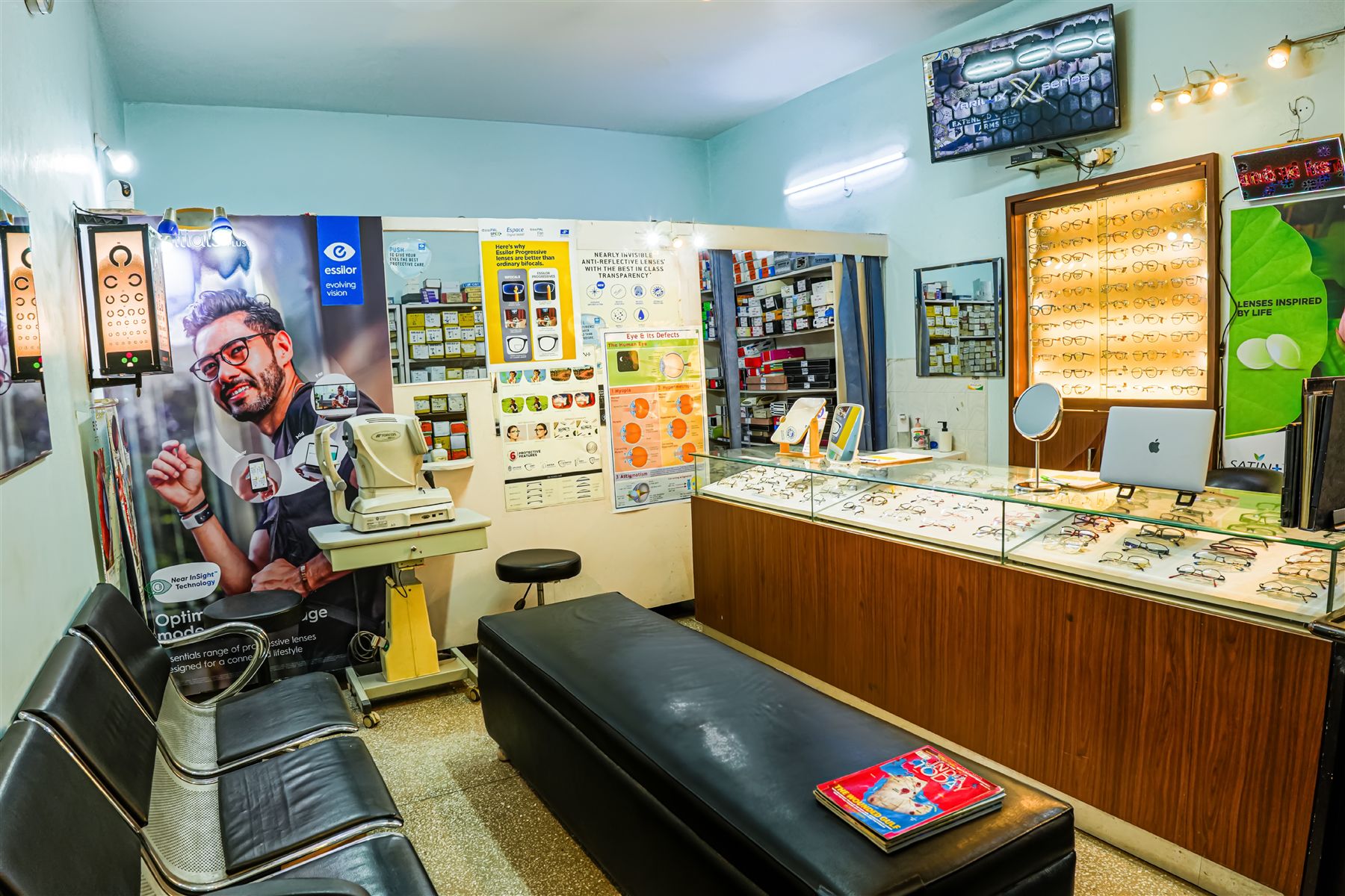 Waiting area and lens display wall at Elite Optical Clinic